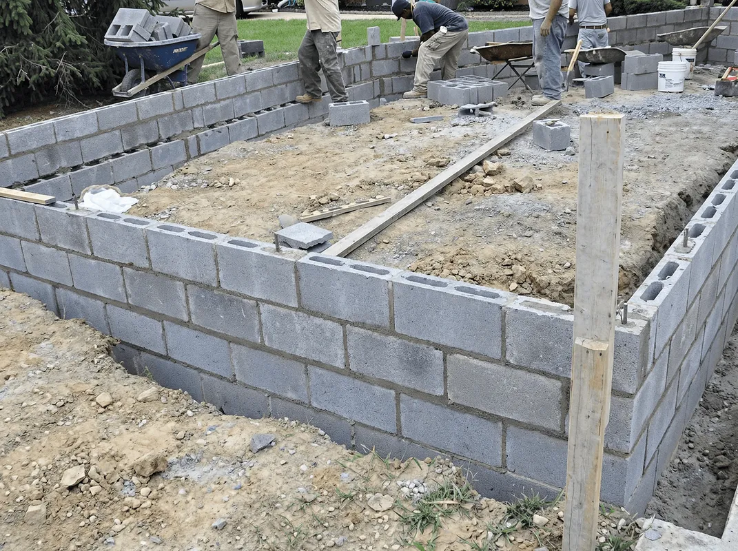 Professionals building a foundation with blocks in Toledo, OH